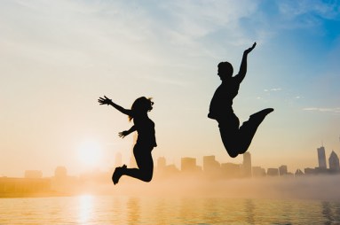 jumping celebration couple